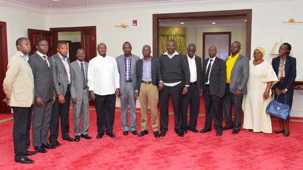 A group of NRM Youth pose for a photo with the president  at the state House in Entenbbe. 