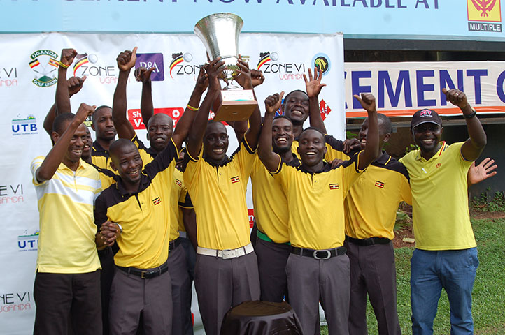  Uganda national golf team raising a trophy  they won in the   championships