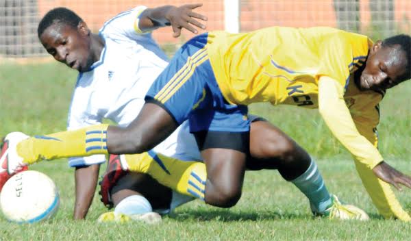Villa’s Steven Bengo (white) and Tom Masiko of (yellow) are set for a midfield battle