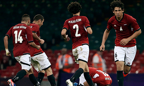 Egypt under-23 team celebrate their third goal.