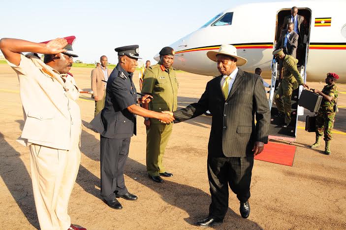 President Museveni being received  back home by the Commissioner General of Prisons Dr Johnson Byabashaija, the Deputy Inspector General of Police Okoth Ochola, and the Deputy Chief of Defence Forces (DCDF) Lt. Gen. Charles Angina.     