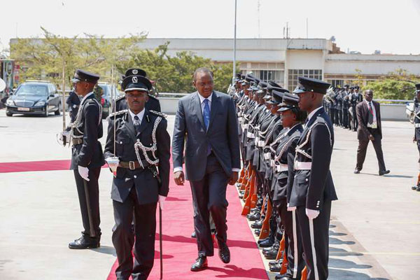 President Uhuru Kenyatta inspect a guard of honour mounted by the Uganda People's Defence Forces (UPDF) on arrival for a special session of the Uganda Parliament in Kampala Uganda yesterday  August 10, 2015.