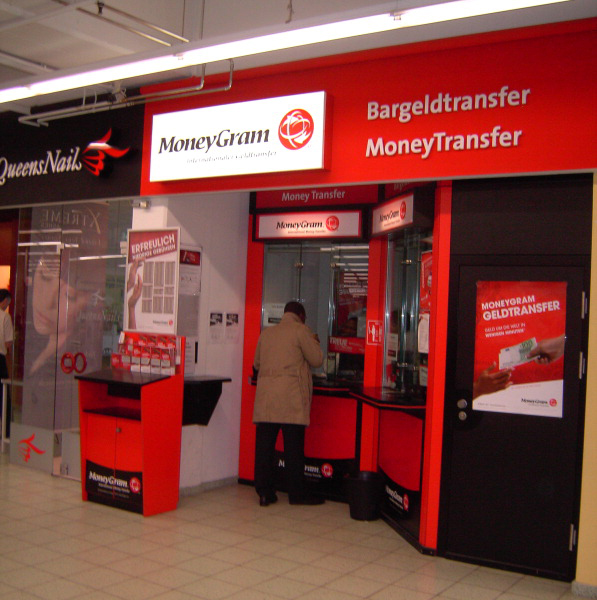 A man conducts business at a MoneyGram site in Essen, Germany. By the end of the year, MoneyGram said it also expects to roll out a mobile version of its website to make it easier for customers in the U.S., the U.K, and Germany to send money. // Byline: MoneyGram International // Submitter: Pete Johnson // 12092012xBIZ
